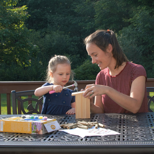 mother and child assembling My First Pollinator House