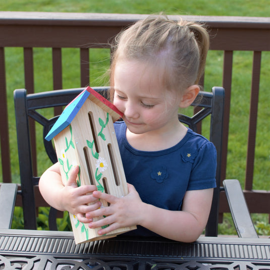 child holding finished My First Butterfly House