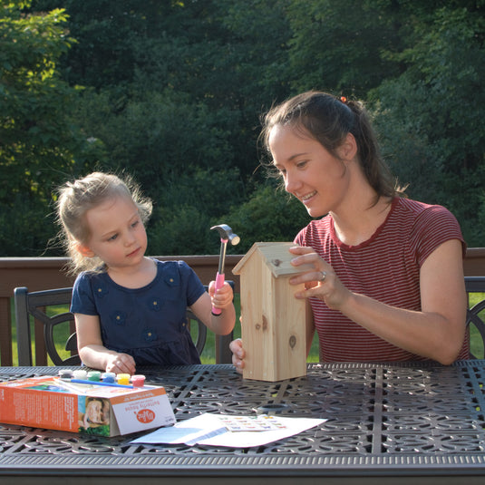 mother and child assembling My First Butterfly House