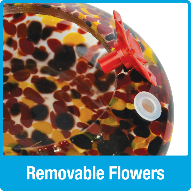Load image into Gallery viewer, Close up of removable red flower feeding ports on Nature's Way red, yellow and black speckled hand blown glass garden hummingbird feeder