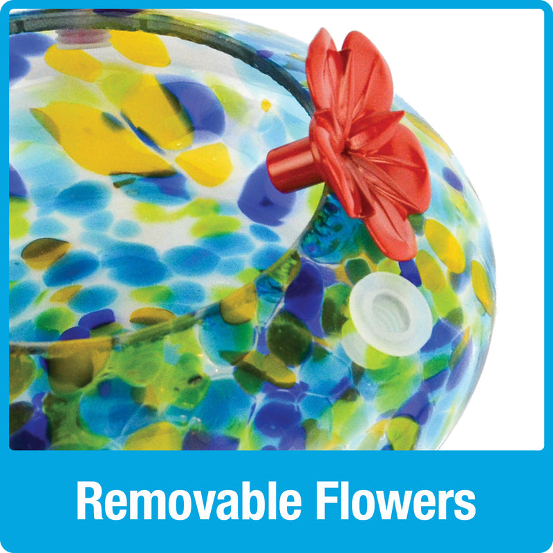 Load image into Gallery viewer, Close up of removable red flowers on the Nature's Way Illuminated Hummingbird hand blown glass Feeder