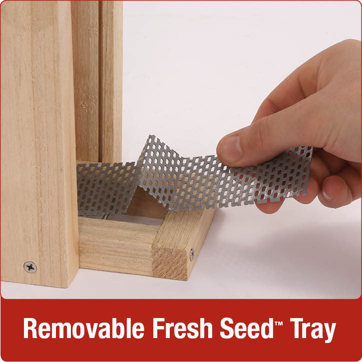 Load image into Gallery viewer, Demonstration of removable fresh seed tray on Nature's Way Vertical Wave cedar bird Feeder