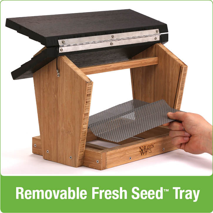 Load image into Gallery viewer, Demonstration of removable fresh seed tray on Nature&#39;s Way 6 QT bamboo Hopper bird Feeder with two Suet cagestform cedar bird Feeder
