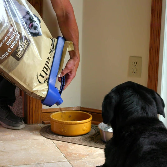 handle-it bag clip on dog kibble bag being poured into food bowl