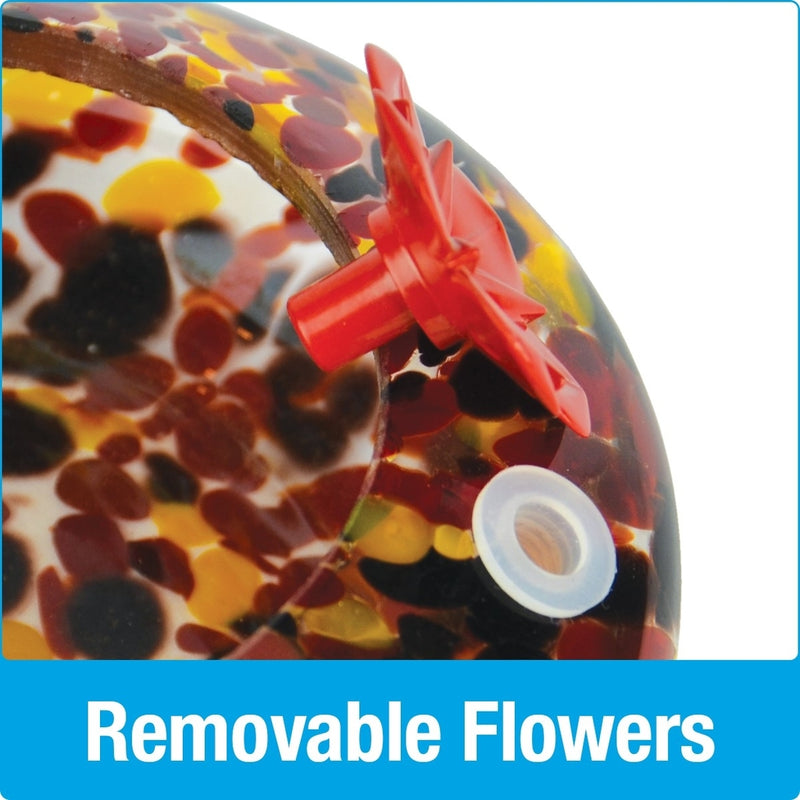Load image into Gallery viewer, Close up of removable red flower feeding ports on Nature's Way hand blown glass garden hummingbird feeder