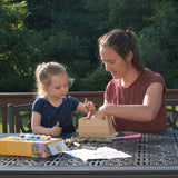 mother and child assembling My First Pollinator House