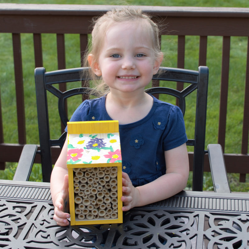 Load image into Gallery viewer, child holding finished My First Pollinator House
