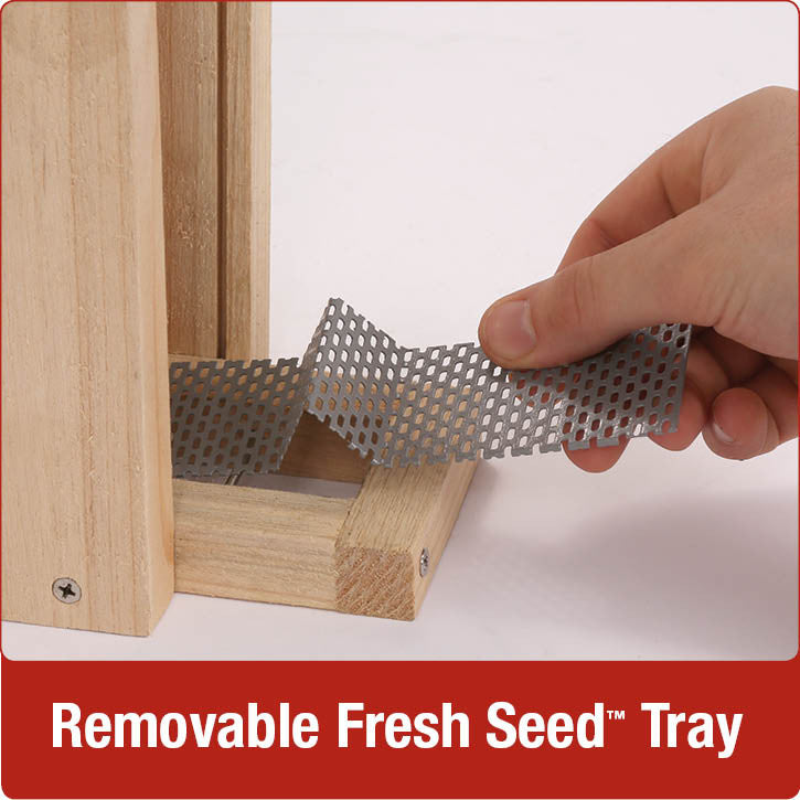 Load image into Gallery viewer, Demonstration of removable fresh seed tray on Nature&#39;s Way Vertical Wave cedar bird Feeder

