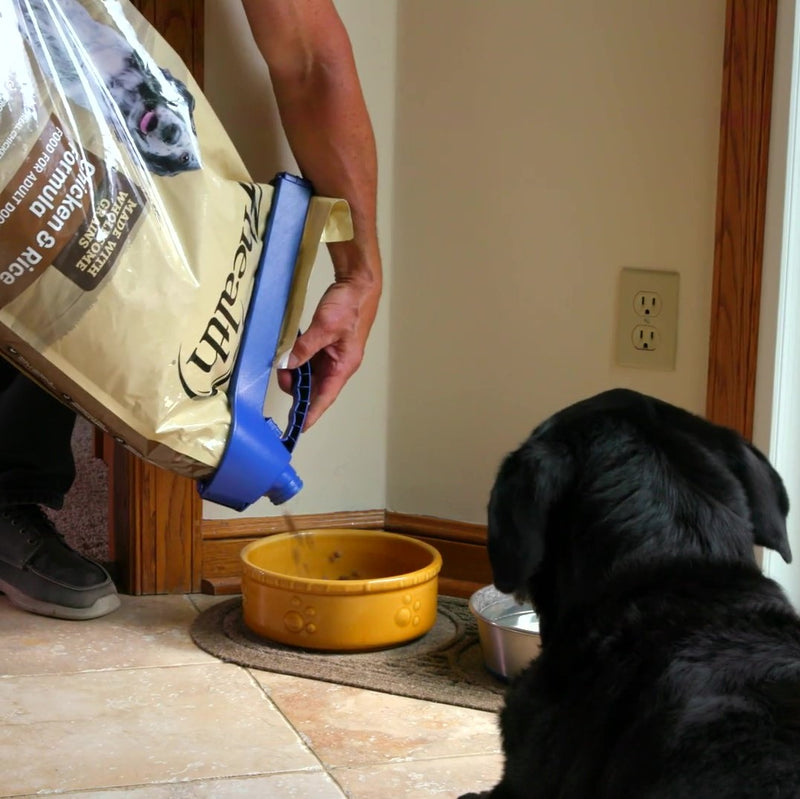 Load image into Gallery viewer, handle-it bag clip on dog kibble bag being poured into food bowl
