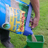 handle-it bag clip on fertilizer bag being poured into spreader