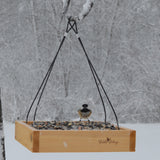 chickadee feeding from Nature's Way Wild Wings Hanging Platform cedar bird Feeder