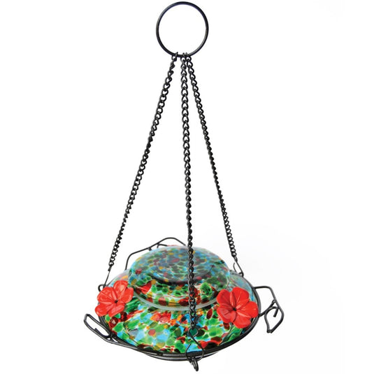 Nature's Way hand blown glass garden hummingbird feeder in ocean sunset with three red flower feeding ports and three decorative leaf perches