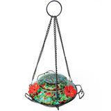 Nature's Way hand blown glass garden hummingbird feeder in ocean sunset with three red flower feeding ports and three decorative leaf perches