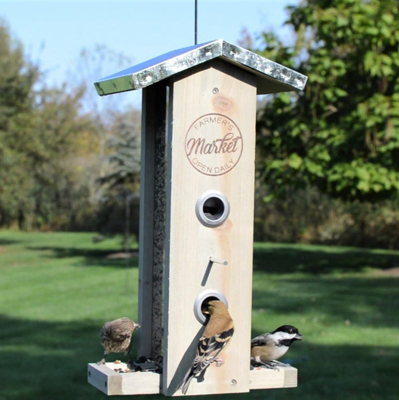 Load image into Gallery viewer, Birds feeding from Nature&#39;s Way Wild Wings decorative weathered vertical feeder with multiple feeding ports and perch platforms
