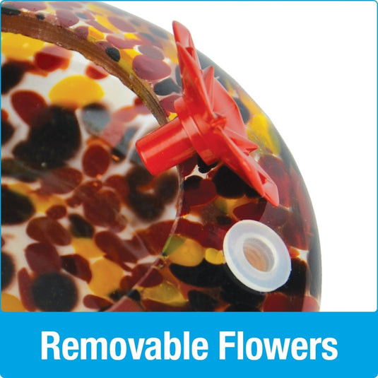 Close up of removable red flower feeding ports on Nature's Way hand blown glass garden hummingbird feeder