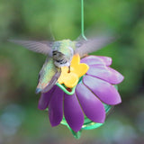 hummingbird feeding from So Real Single Flower Hummingbird Feeder - Purple
